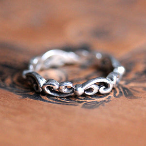 Sterling silver swirling wave band ring