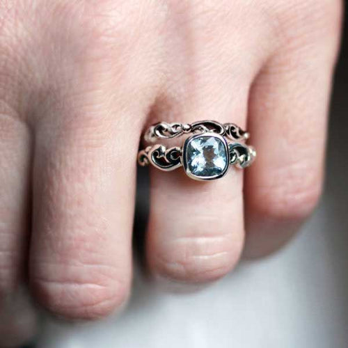 aquamarine engagement ring set on the hand