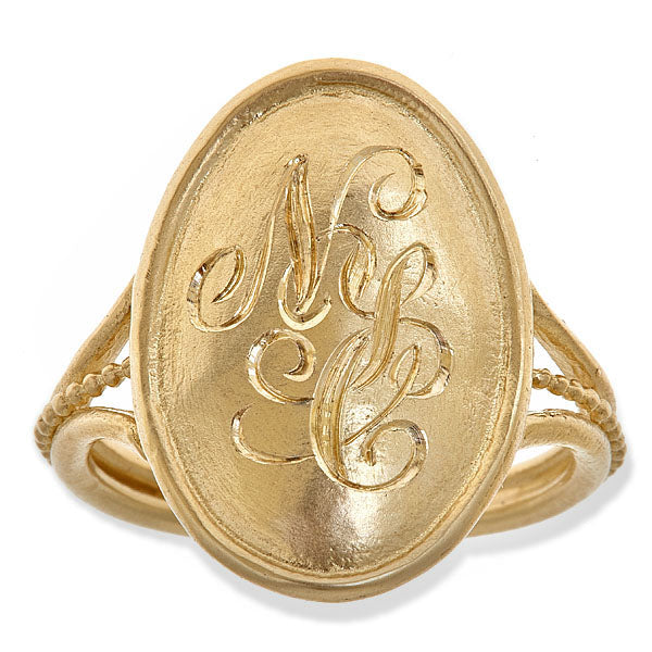 14K gold vintage style ring that is elegantly engraved with a three letter monogram. 