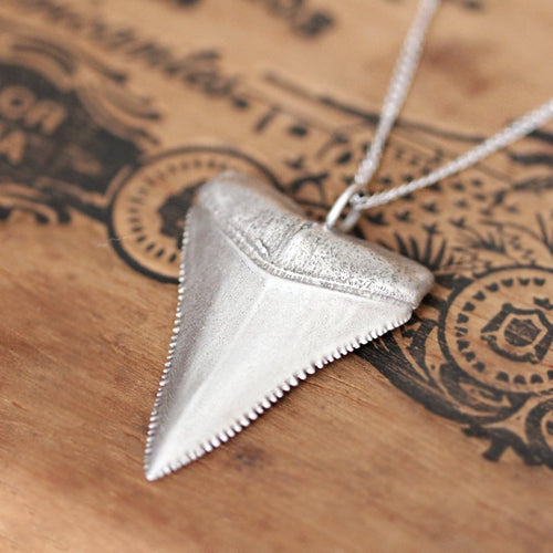 Close-up view of great white shark tooth sterling silver necklace from Metalicious