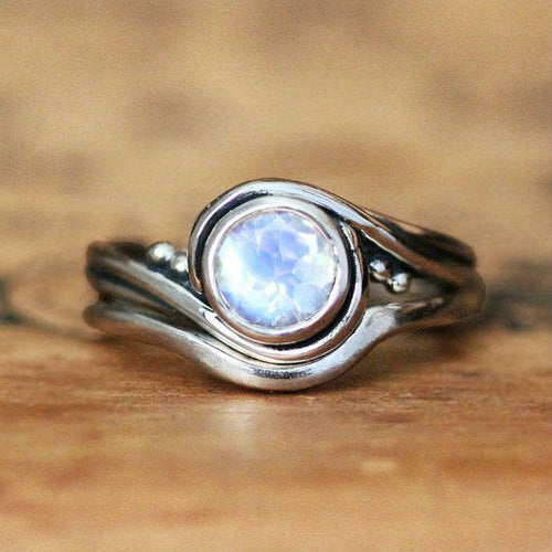 Close view of our handmade engagement ring set with a rainbow moonstone from Metalicious